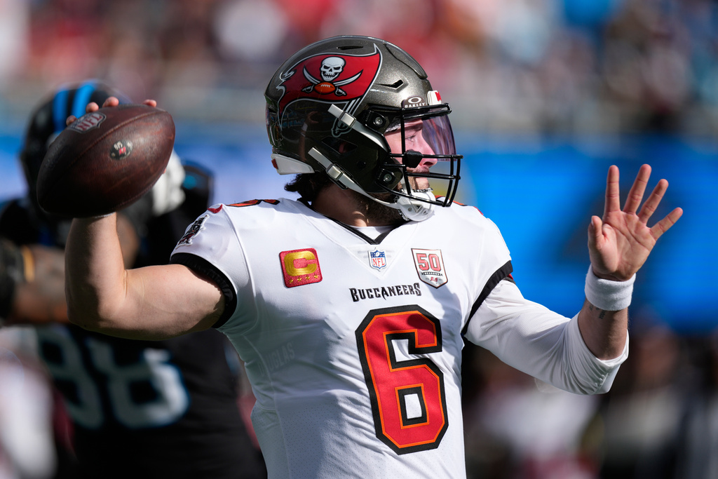 Tampa Bay Buccaneers quarterback Baker Mayfield passes against the Carolina Panthers during the first half of an NFL football game, Sunday, Dec. 21, 2025, in Charlotte, N.C. (AP Photo/Jacob Kupferman)