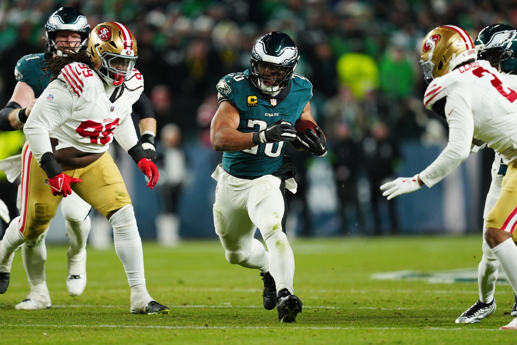 Philadelphia Eagles running back Saquon Barkley (26) runs the ball during the second half of an NFL wild-card playoff football game against the San Francisco 49ers on Sunday, Jan. 11, 2026, in Philadelphia. (AP Photo/Derik Hamilton)