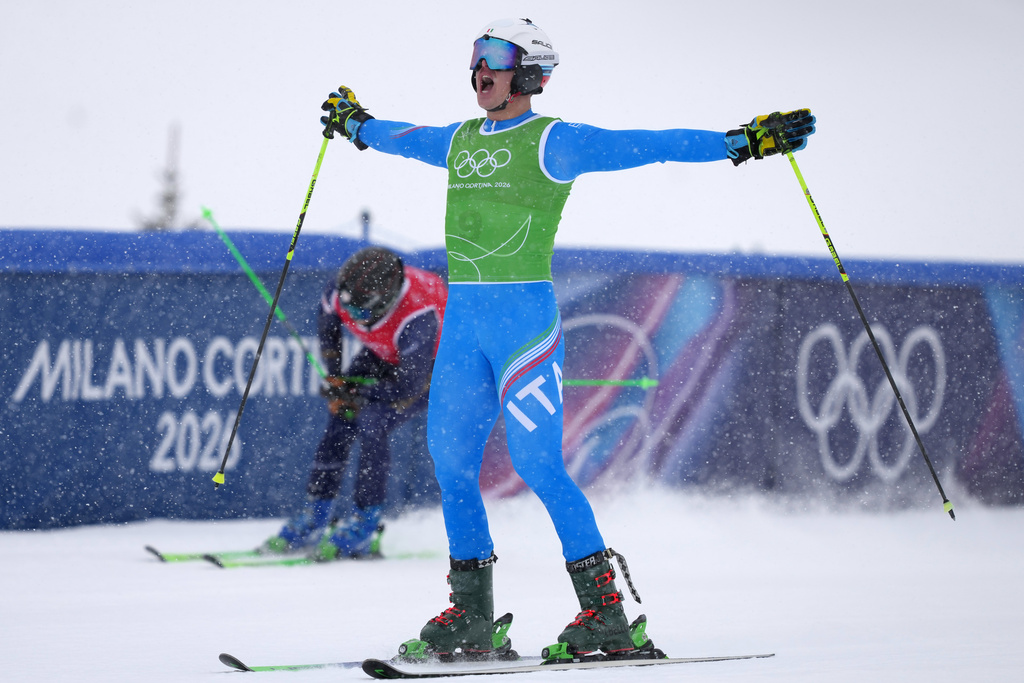 Italian freeskiers race through flurries to grab more medals for the Olympic host country