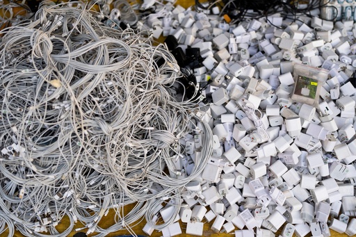 FILE -Used charging cables and power adapters are piled up at a shop in Nhat Tao market, the largest informal recycling market in Ho Chi Minh City, Vietnam, Jan. 28, 2024. (AP Photo/Jae C. Hong, File) FILE -Used charging cables and power adapters are piled up at a shop in Nhat Tao market, the largest informal recycling market in Ho Chi Minh City, Vietnam, Jan. 28, 2024. (AP Photo/Jae C. Hong, File)