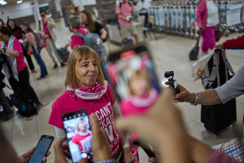 CODEPINK co-founder Medea Benjamin speaks with the press after arriving at the airport with other activists as part of the "Nuestra America," or Our America Convoy, in Havana, Cuba, Friday, March 20, 2026. (AP Photo/Ramon Espinosa)