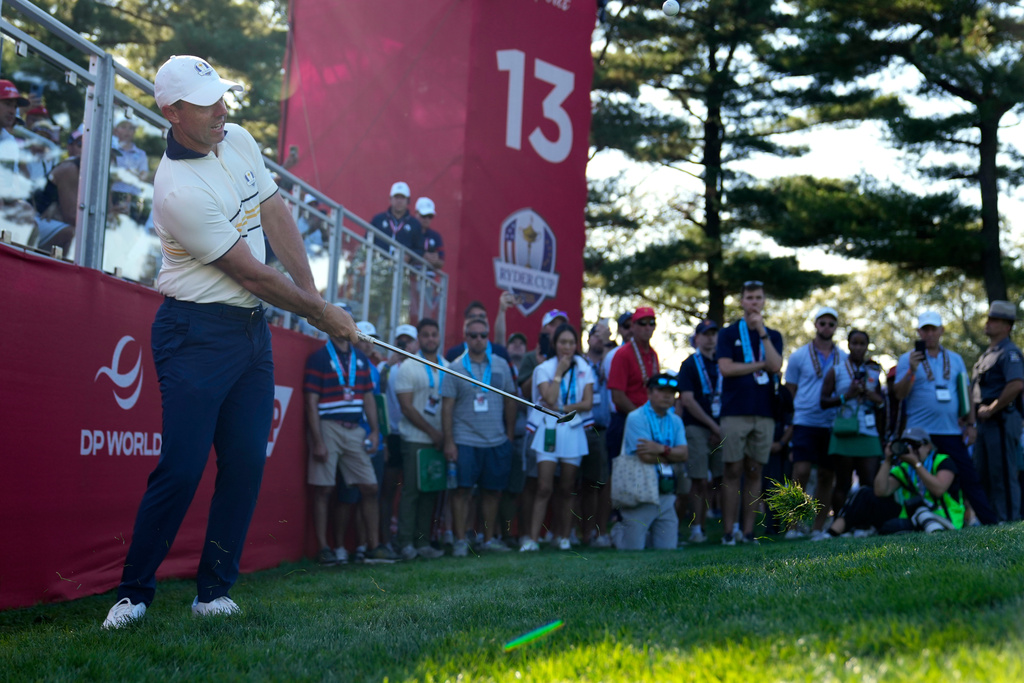 Europe's Rory McIlroy hits from the rough on the 13th hole during their singles match on the Bethpage Black golf course at the Ryder Cup golf tournament, Sunday, Sept. 28, 2025, in Farmingdale, N.Y. (AP Photo/Seth Wenig)