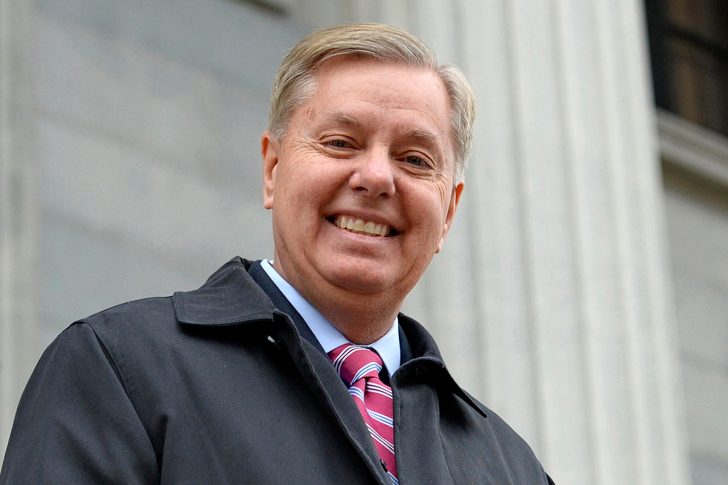 FILE - Sen. Lindsey Graham, R- S.C., walks down the steps of the State Capitol building in Columbia, S.C., Jan. 14, 2015. (AP Photo/Richard Shiro, File)