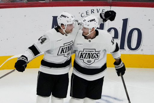 Los Angeles Kings right wing Alex Laferriere, left, celebrates with right wing Corey Perry, right, after his goal during the second period of an NHL hockey game against the Chicago Blackhawks, Sunday, Oct. 26, 2025, in Chicago. (AP Photo/David Banks) Los Angeles Kings right wing Alex Laferriere, left, celebrates with right wing Corey Perry, right, after his goal during the second period of an NHL hockey game against the Chicago Blackhawks, Sunday, Oct. 26, 2025, in Chicago. (AP Photo/David Banks)