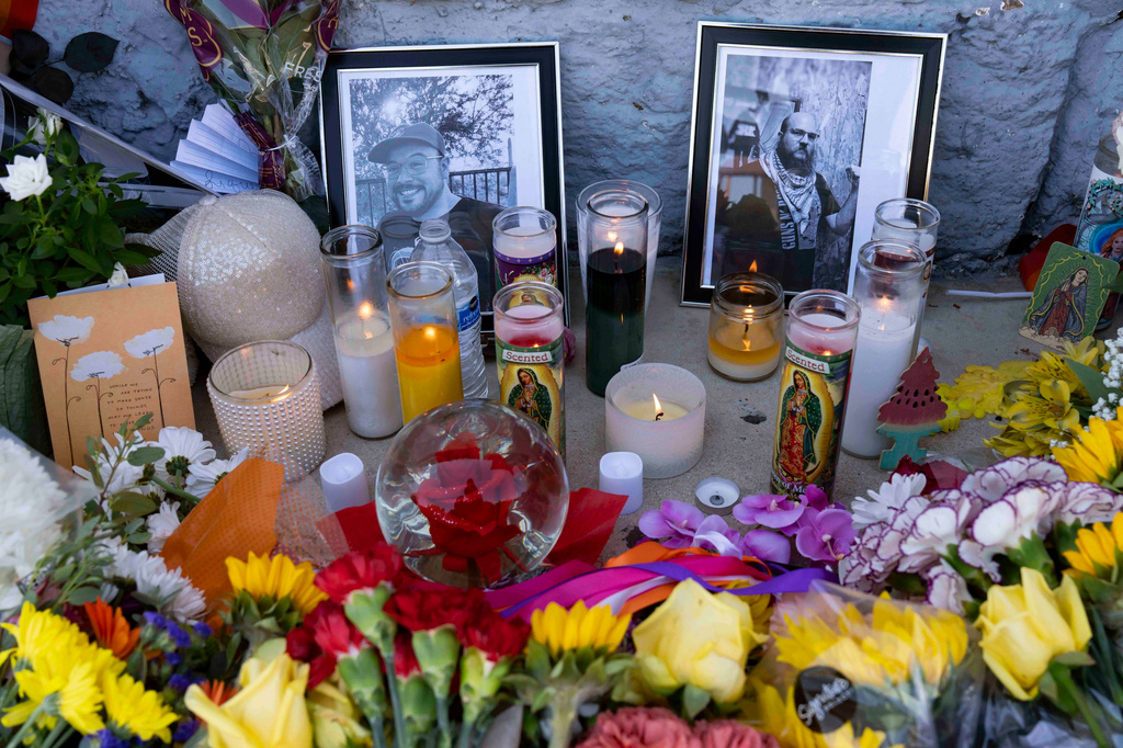 A growing memorial sits outside the Venture-N Bar in Tucson, Ariz., Tuesday, Sept. 1, 2026, for Vincent Siquieros and Cameron Capara, pictured, who were fatally shot in the parking lot of the gay bar shortly after midnight Monday. (AP Photo/Rebecca Noble)