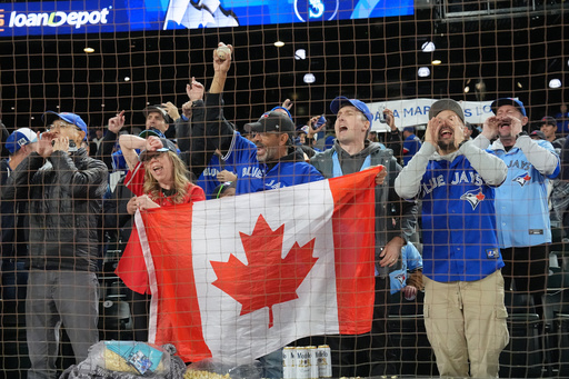 Toronto Blue Jays fans celebrate after the Blue Jays defeated the Seattle Mariners in Game 3 of baseball's American League Championship Series, Wednesday, Oct. 15, 2025, in Seattle. (Frank Gunn/The Canadian Press via AP) Toronto Blue Jays fans celebrate after the Blue Jays defeated the Seattle Mariners in Game 3 of baseball's American League Championship Series, Wednesday, Oct. 15, 2025, in Seattle. (Frank Gunn/The Canadian Press via AP)