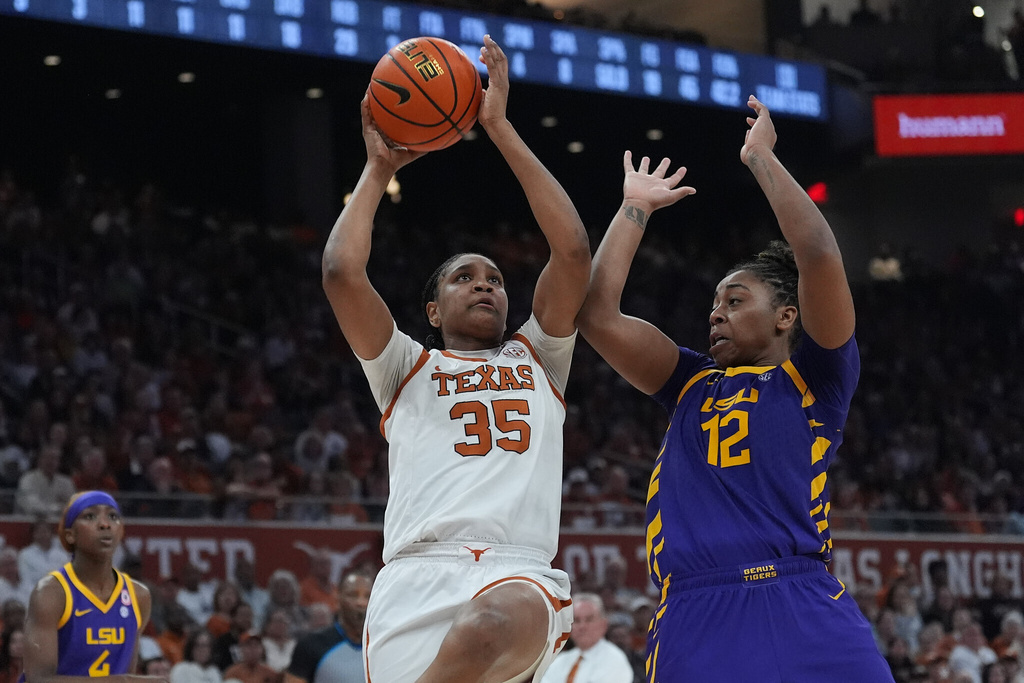 Texas forward Madison Booker (35) shoots against LSU guard Mikaylah Williams (12) during the second half of an NCAA college basketball game in Austin, Texas, Thursday, Feb. 5, 2026. (AP Photo/Eric Gay)