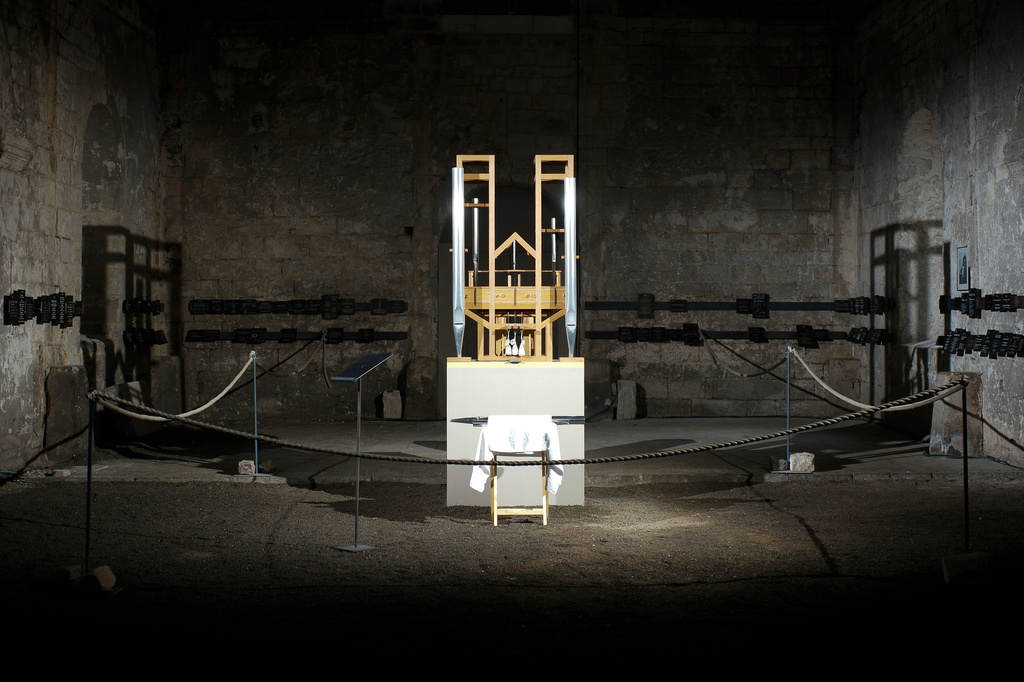 FILE - The organ of the John Cage organ project is illuminated prior to a 'sound change' at the Buchardi Church in Halberstadt, Germany, Sept. 5, 2020. (AP Photo/Markus Schreiber, File)