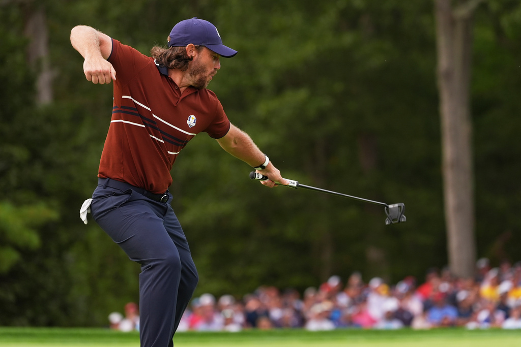 Europe's Tommy Fleetwood celebrates after a putt on the 13th hole at Bethpage Black golf course during the Ryder Cup golf tournament, Saturday, Sept. 27, 2025, in Farmingdale, N.Y. (AP Photo/Lindsey Wasson)