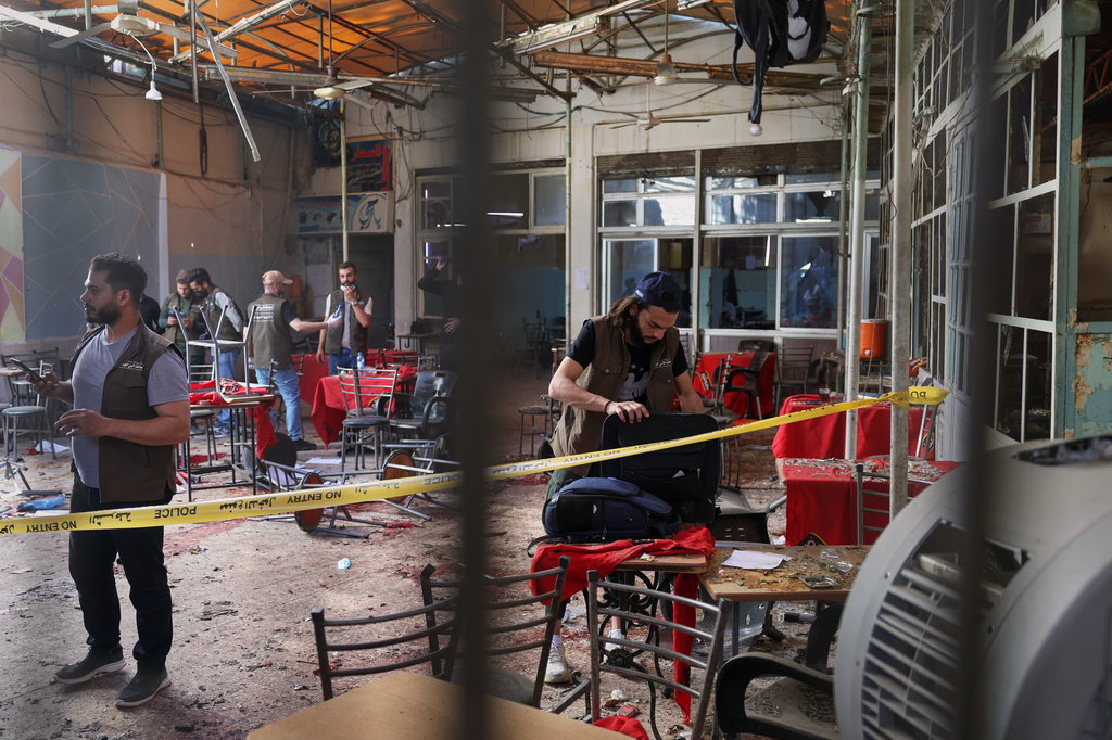 Syrian security inspects the site after an explosive device was detonated in a cafe near the main courthouse complex, in Damascus, Syria, Thursday, July 2, 2026 (AP Photo/Ghaith Alsayed)