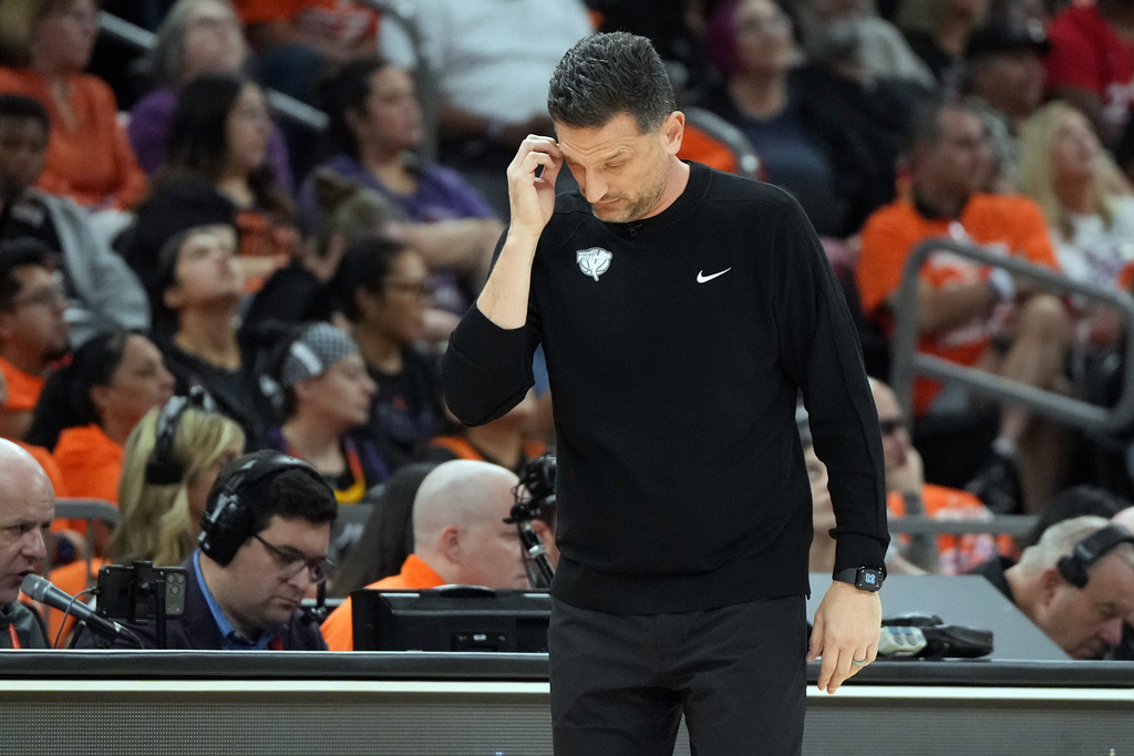 Phoenix Mercury head coach Nate Tibbetts reacts after a play against the Las Vegas Aces during the second half of Game 3 of the WNBA basketball finals, Wednesday, Oct. 8, 2025, in Phoenix. (AP Photo/Rick Scuteri)