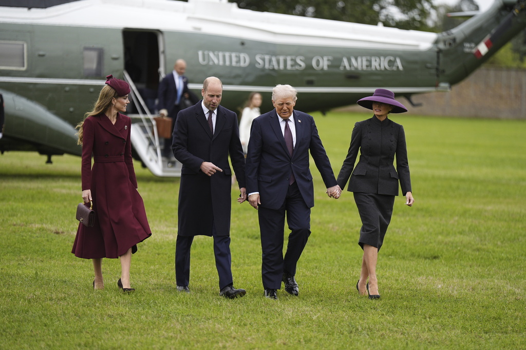 Britain's Prince William and Kate, Princess of Wales, left, receive President Donald Trump and first lady Melania Trump at Windsor Castle in Windsor, England, Wednesday Sept. 17, 2025. (Aaron Chown/Pool Photo via AP)