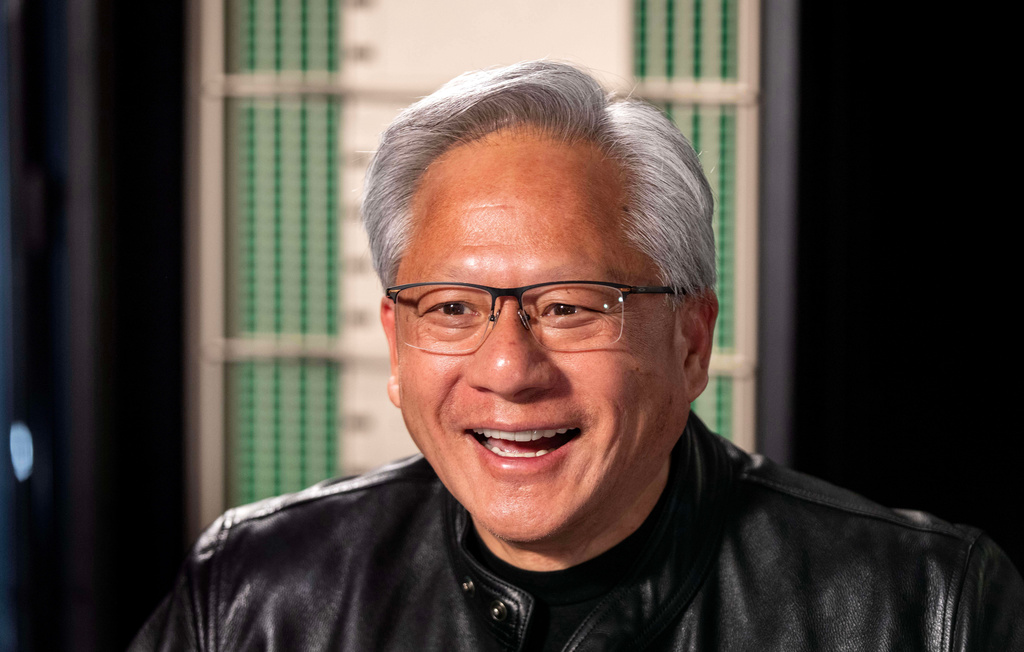 Jensen Huang, president and CEO of Nvidia, laughs during an interview before a groundbreaking ceremony for an expansion of Coherent's manufacturing facility on Tuesday, June 16, 2026, in Sherman, Texas. (AP Photo/Jeffrey McWhorter)