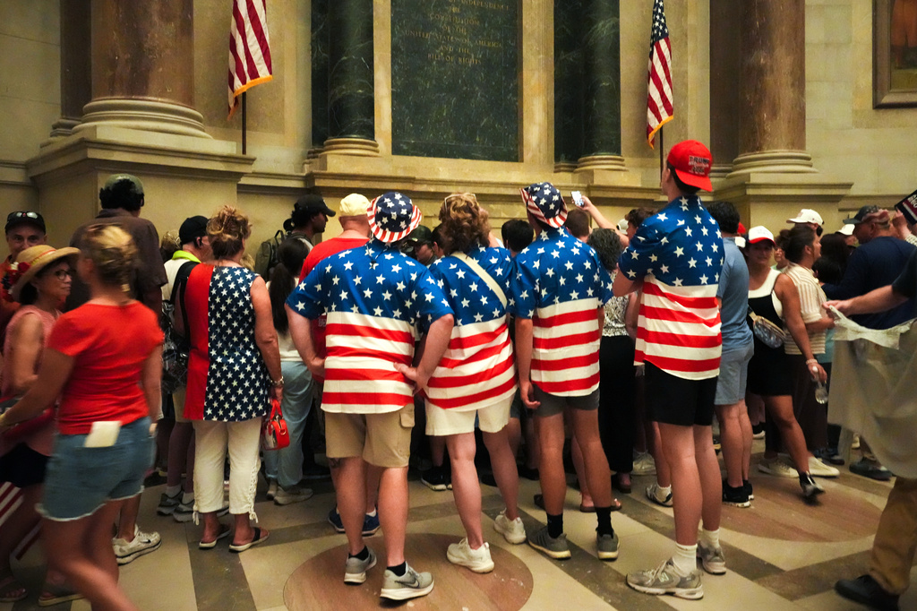 People wait to look at the original Declaration of Independence and U.S. Constitution at the National Archives Museum, Friday, July 3, 2026, in Washington. (AP Photo/Julia Demaree Nikhinson)