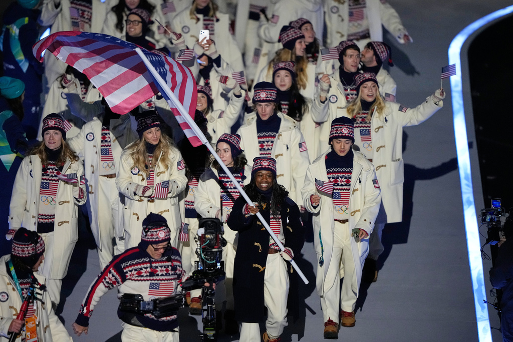 Erin Jackson, flag bearer of United States, leads American athletes as they walk during the Olympic opening ceremony at the 2026 Winter Olympics, in Milan, Italy, Friday, Feb. 6, 2026. (AP Photo/Lee Jin-man)