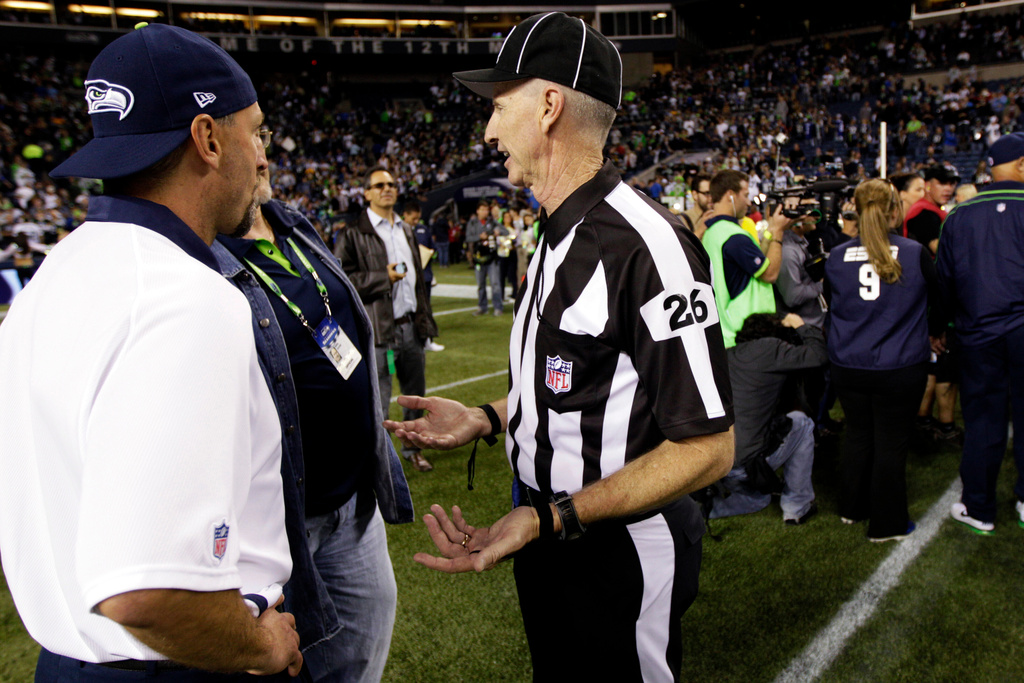 FILE - Official Lance Easley (26) gestures on the field following the Seattle Seahawks' 14-12 win over the Green Bay Packers in an NFL football game, Monday, Sept. 24, 2012, in Seattle. (AP Photo/Ted S. Warren, File)