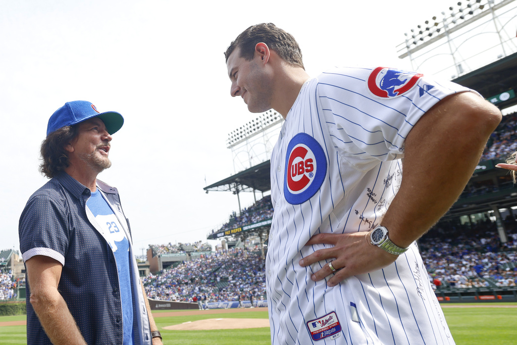 Former Chicago Cubs player Anthony Rizzo, right, chats with Eddie Vedder before a baseball game between the Chicago Cubs and Tampa Bay Rays, Saturday, Sept. 13, 2025, in Chicago. (AP Photo/Kamil Krzaczynski)