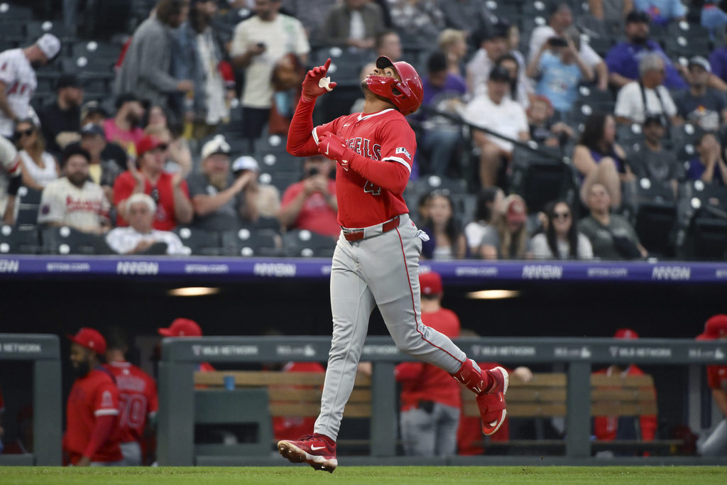 ADDS THAT IT WAS A TWO-RUN HOME RUN - Los Angeles Angels' Christian Moore celebrates while approaching home plate on a two-run home run in the second inning of a baseball game against the Colorado Rockies, Friday, Sept. 19, 2025, in Denver. (AP Photo/Geneva Heffernan)