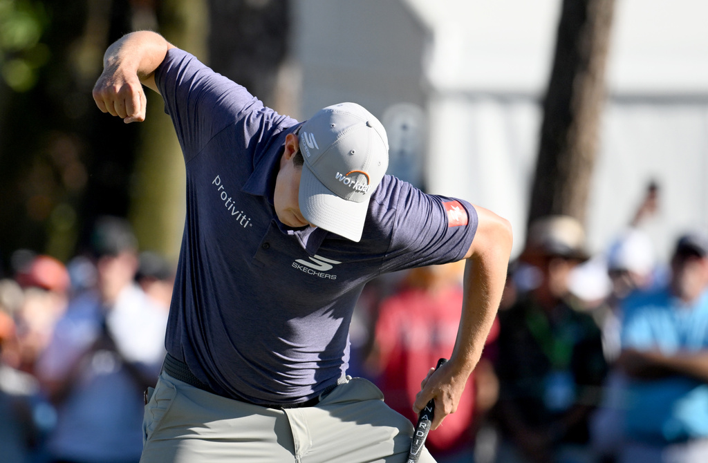 Matt Fitzpatrick celebrates his birdie putt on the 18th hole during the final round of the Valspar Championship golf tournament Sunday, March 22, 2026, in Palm Harbor, Fla. (AP Photo/Jason Behnken)