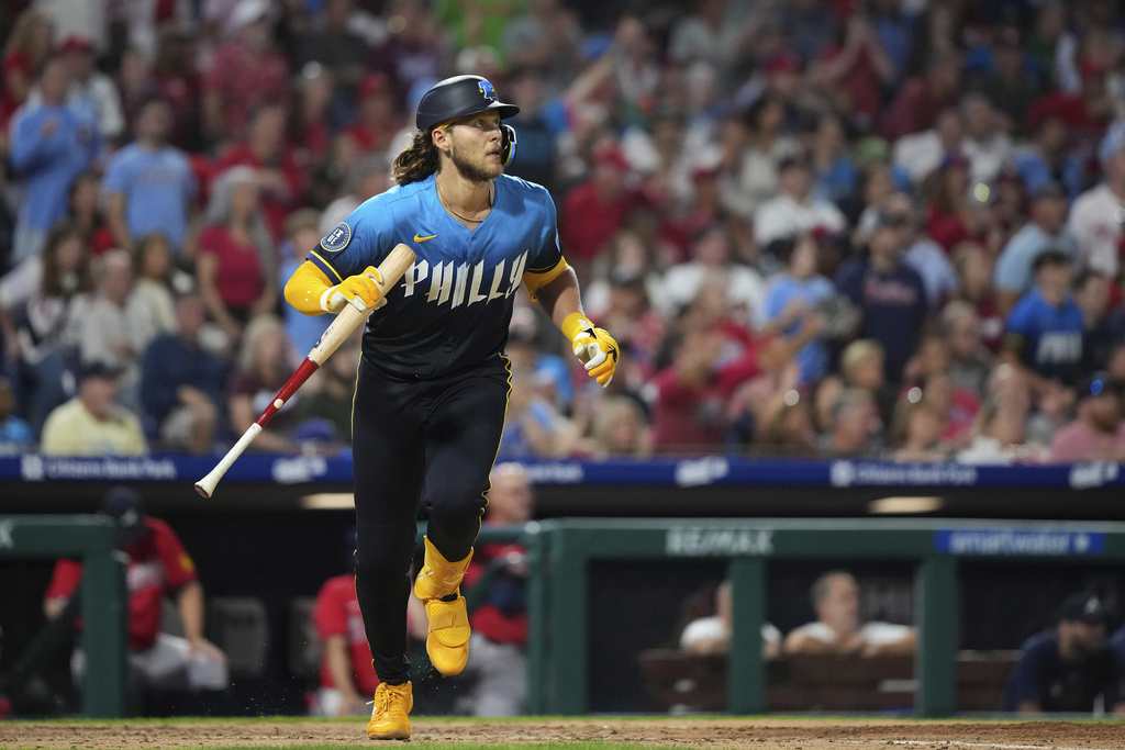 Philadelphia Phillies' Alec Bohm watches after hitting an RBI-sacrifice fly against Atlanta Braves pitcher Pierce Johnson during the eighth inning of a baseball game Friday, Aug. 29, 2025, in Philadelphia. (AP Photo/Matt Slocum)
