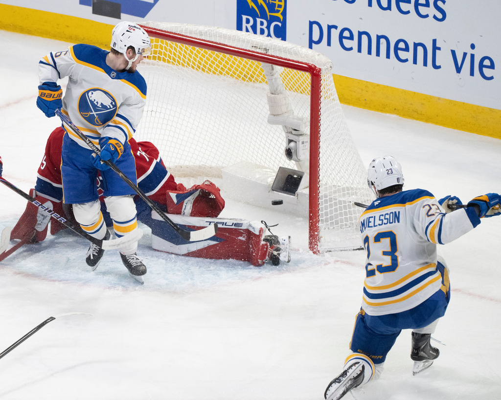 Buffalo Sabres' Mattias Samuelsson (23) scores on Montreal Canadiens goaltender Jakub Dobes (75) as Zach Benson (6) blocks during first period second round, Game 4, NHL playoff game in Montreal on Tuesday, May 12, 2026. (Christinne Muschi/The Canadian Press via AP)