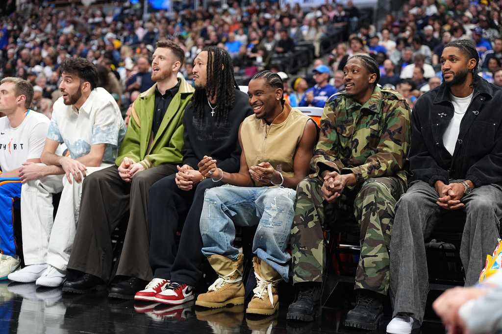From left, Oklahoma City Thunder players Chet Holmgren, Isaiah Hartenstein, Oklahoma City Thunder forward Jaylin Williams, Shai Gilgeous-Alexander, Jalen Williams and Isaiah Joe look on from the bench in the first half of an NBA basketball game against the Denver Nuggets Friday, April 10, 2026, in Denver. (AP Photo/David Zalubowski)