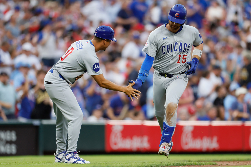 Chicago Cubs' Carson Kelly, right, celebrates his home run against Cincinnati Reds' Nick Lodolo during the sixth inning of a baseball game, Saturday, July 11, 2026, in Cincinnati. (AP Photo/Jay LaPrete)