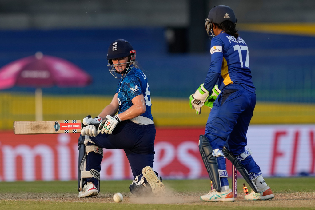 England's Emma Lamb looks back after being bowled during the ICC Women's Cricket World Cup match between England and Sri Lanka at Premadasa Stadium in Colombo, Sri Lanka, Saturday, Oct. 11, 2025. (AP Photo/Eranga Jayawardena)