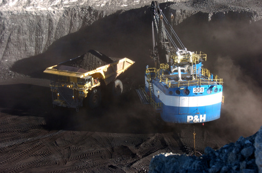 FILE - A haul truck is seen after being loaded with coal by a mechanized shovel at the Spring Creek mine, in this Nov. 15, 2016 photo, near Decker, Mont. (AP Photo/Matthew Brown) FILE - A haul truck is seen after being loaded with coal by a mechanized shovel at the Spring Creek mine, in this Nov. 15, 2016 photo, near Decker, Mont. (AP Photo/Matthew Brown)