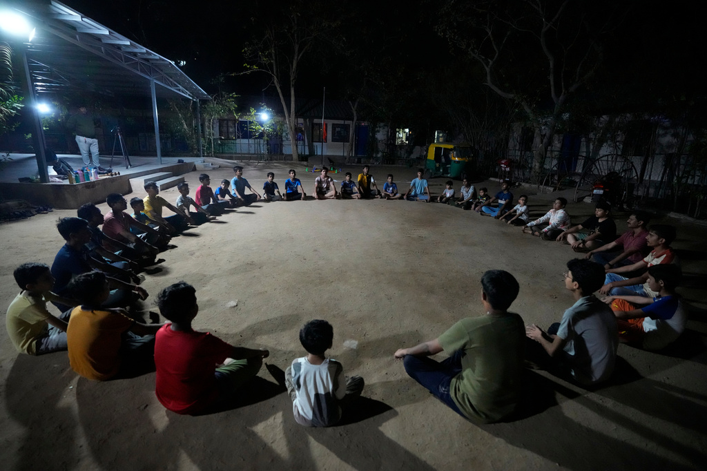 FILE - Youths participate in a Hindu nationalist organisation Rashtriya Swayamsevak Sangh (RSS) shakha in Ahmedabad, India, April 8, 2024. Shakhas, or local units, induct boys by combining religious education with self-defense skills and games. (AP Photo/Ajit Solanki, File)