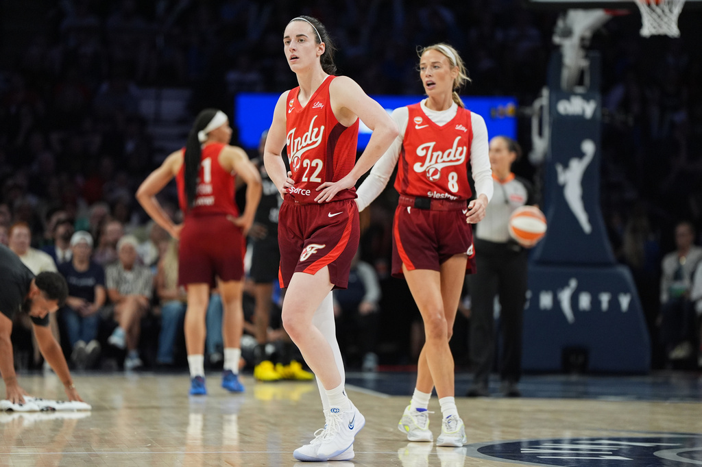 Indiana Fever guards Caitlin Clark (22) and Sophie Cunningham (8) wait for play to resume during the second half of a WNBA basketball game against the Minnesota Lynx, Sunday, Aug. 2, 2026, in Minneapolis. (AP Photo/Abbie Parr)