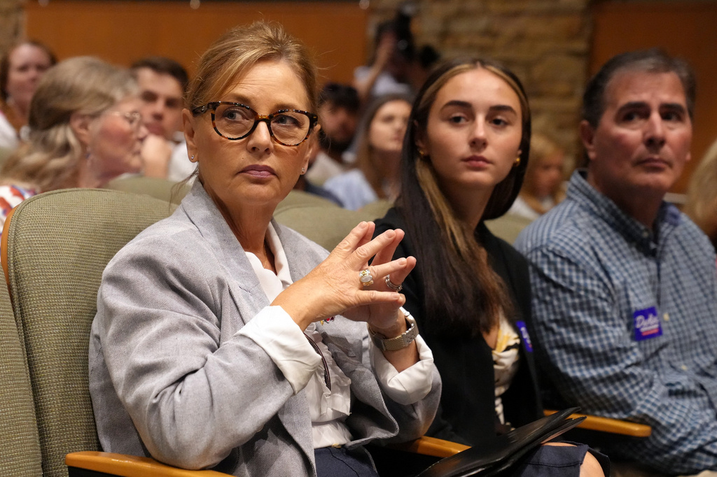 Sen. Darline Graham, R-S.C., from left, seated alongside daughter Nicole Nordone and husband Larry Nordone, looks on as a South Carolina Republican Senate candidate stump event gets underway ahead of the special GOP primary to replace her late brother, Sen. Lindsey Graham, R-S.C., Saturday, Aug. 1, 2026, in Lexington, S.C. (AP Photo/Meg Kinnard)
