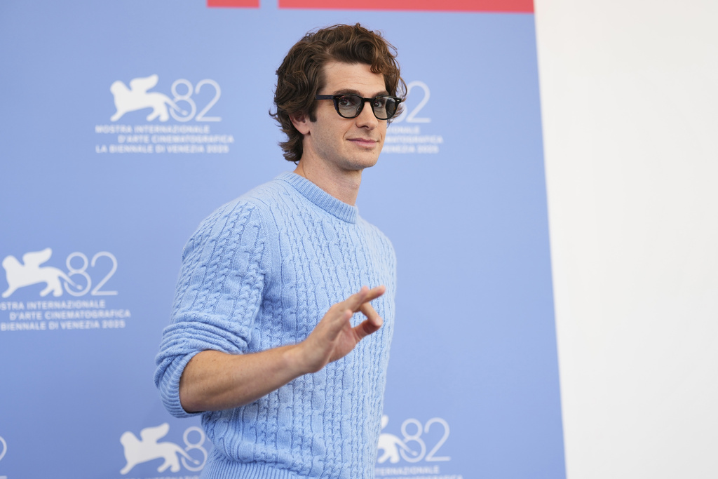 Andrew Garfield poses for photographers at the photo call for the film 'After the Hunt' during the 82nd edition of the Venice Film Festival in Venice, Italy, on Friday, Aug. 29, 2025. (Photo by Scott A Garfitt/Invision/AP)