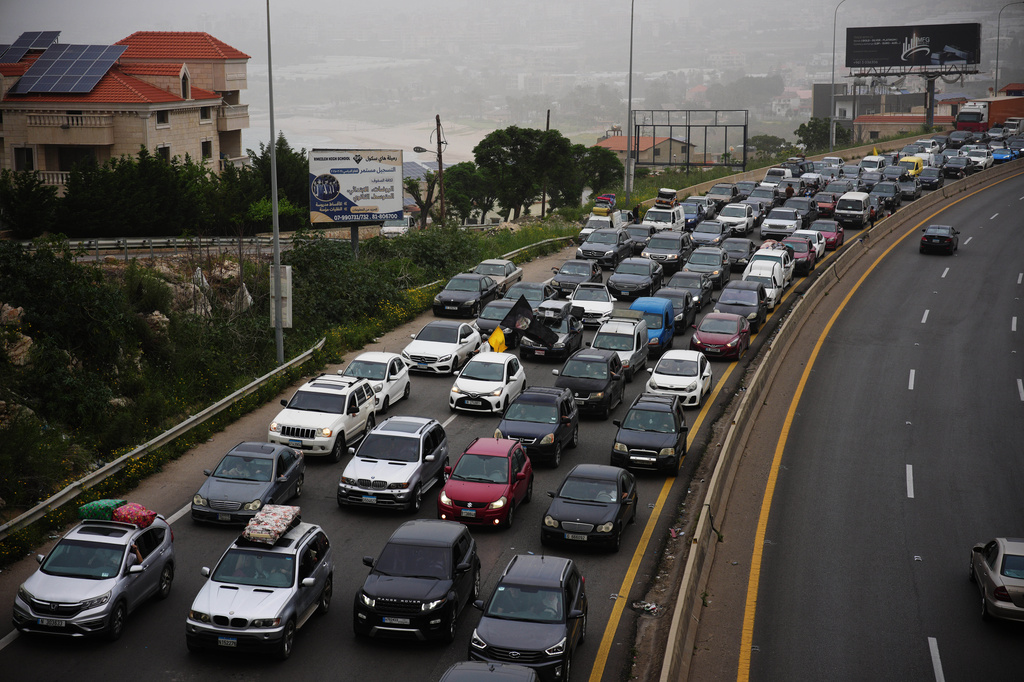 Displaced residents drive back to their villages following a ceasefire between Israel and Hezbollah, in Jiyeh, near Saida, southern Lebanon, Friday, April 17, 2026. (AP Photo/Hassan Ammar)