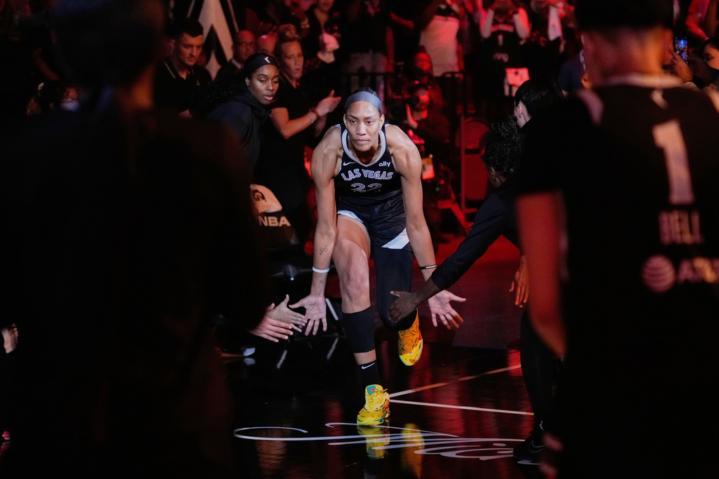 FILE - Las Vegas Aces center A'ja Wilson (22) runs onto the court before Game 5 of a WNBA basketball playoff semifinals series between the Las Vegas Aces and the Indiana Fever, Tuesday, Sept. 30, 2025, in Las Vegas. (AP Photo/John Locher, File)
