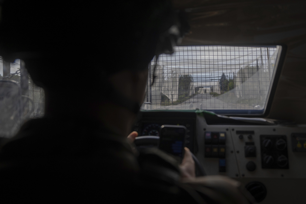 A Ukrainian serviceman drives an armored vehicle close to the front line near Kostiantynivka, Ukraine, on Wednesday, Sept. 10, 2025. (AP Photo/Alex Babenko)