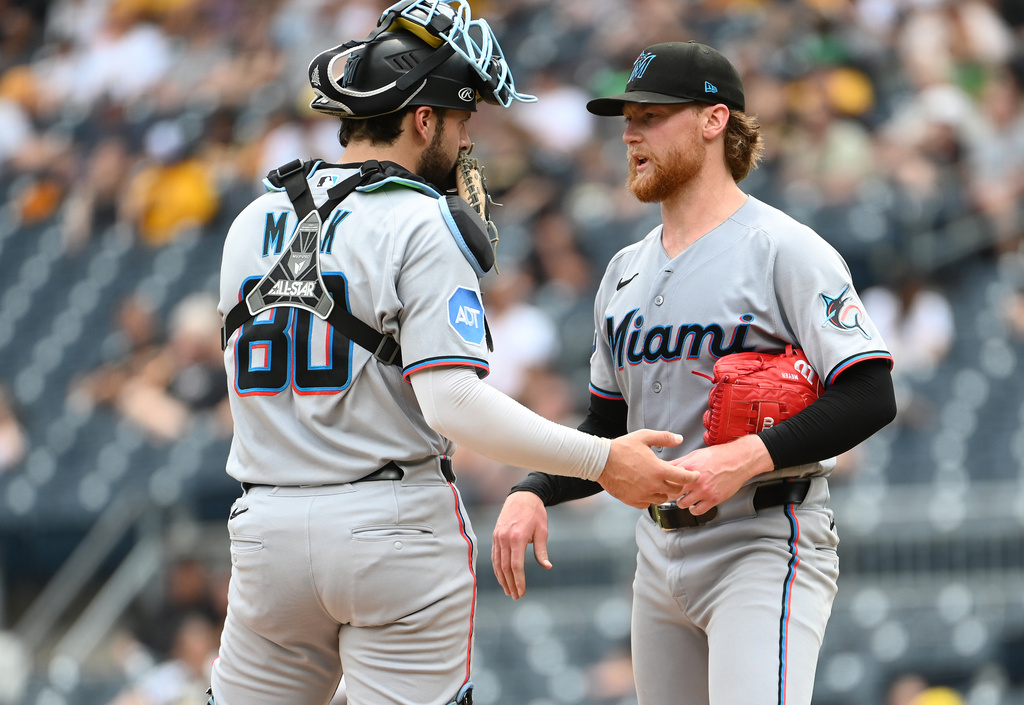 Miami Marlins catcher Joe Mack (left) talks with starting pitcher Max Meyer (23) before throwing to the Pittsburgh Pirates during the sixth inning of a baseball game, Sunday, June 14, 2026, in Pittsburgh. (AP Photo/Philip G. Pavely)