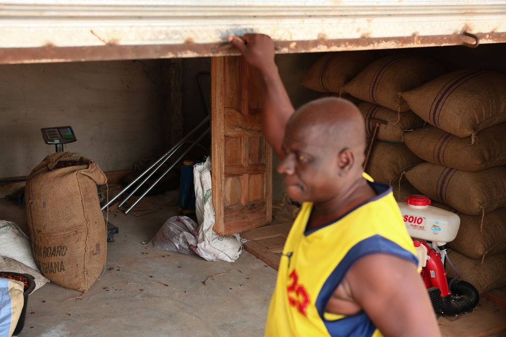 Bags of cocoa beans are stacked in a storage facility in Kona, Ghana, Friday, March 6, 2026. (AP Photo/Tsraha Yaw)