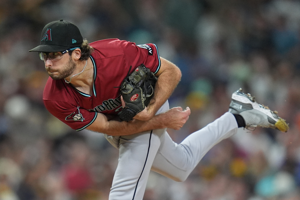 FILE - Arizona Diamondbacks starting pitcher Zac Gallen works against a San Diego Padres batter during the third inning of a baseball game Friday, Sept. 26, 2025, in San Diego. (AP Photo/Gregory Bull,File)