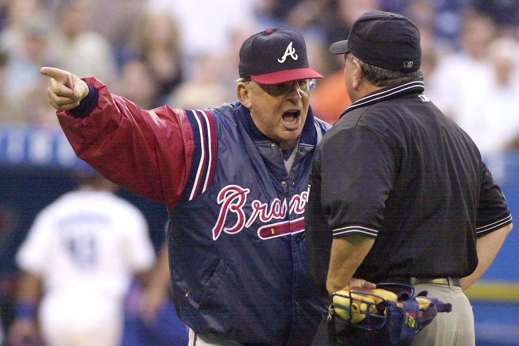 FILE - Atlanta Braves manager Bobby Cox, left, argues with home plate umpire Rick Reed during the fourth inning of interleague play against the Toronto Blue Jays, in Toronto, June 13, 2001. (Aaron Harris/The Canadian Press via AP, File)