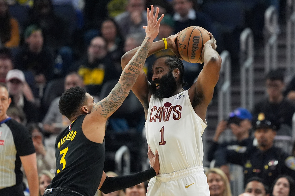 Cleveland Cavaliers guard James Harden (1) looks to pass the ball while being defended by Golden State Warriors guard Will Richard during the first half of an NBA basketball game in San Francisco, Thursday, April 2, 2026. (AP Photo/Jeff Chiu)