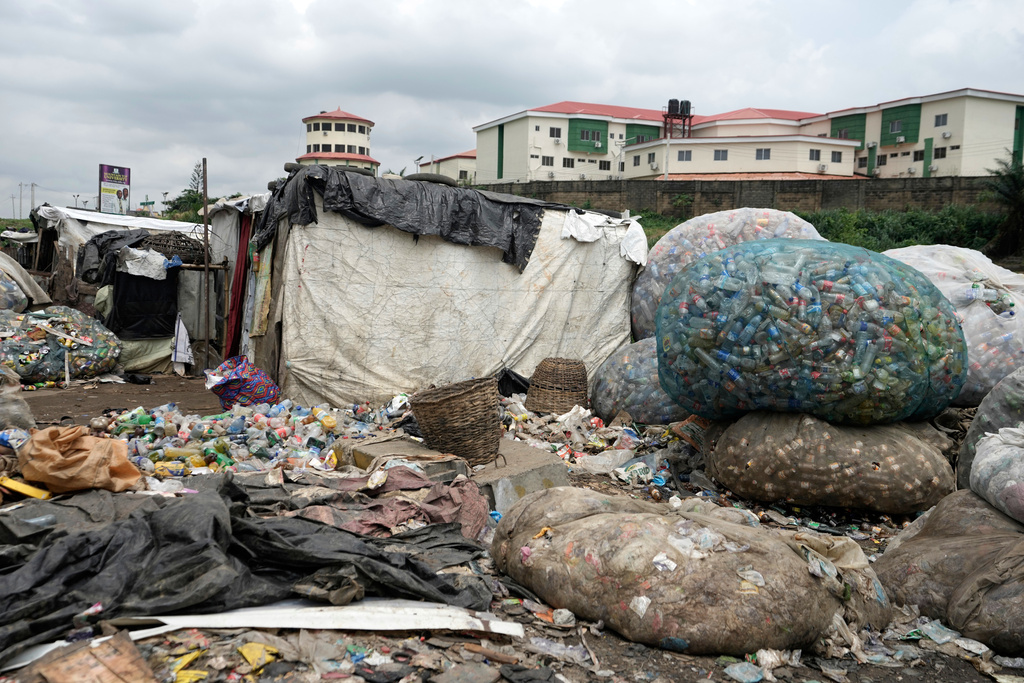 Package plastic waste is seen at a dumpsite on the outskirts of Lagos, Nigeria, Monday, Aug 11, 2025. (AP Photo/Sunday Alamba)