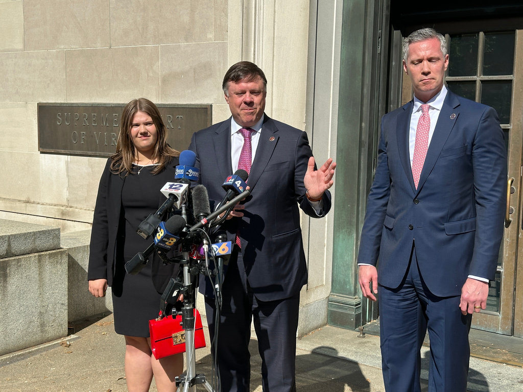 State Senate Minority Leader Ryan McDougle, center, speaks outside the Supreme Court of Virginia after arguments were heard in a redistricting-related case at the court in Richmond, Va., on Monday, April 27, 2026. (AP Photo/Allen G. Breed)