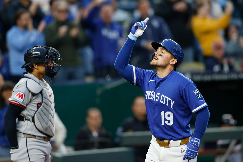 Kansas City Royals' Michael Massey, reacts as he celebrates his two-run home run as he crosses home plate near Cleveland Guardians catcher Bo Naylor, left, during the fourth inning of a baseball game against the Cleveland Guardians in Kansas City, Mo., Tuesday, May 5, 2026. (AP Photo/Colin E. Braley)