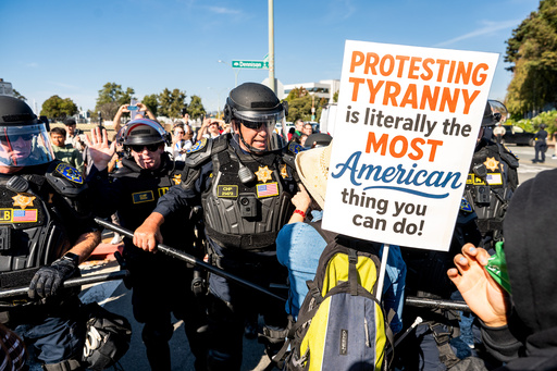 California Highway Patrol officers move back protesters who were blocking the entrance to Coast Guard Base Alameda on Thursday, Oct. 23, 2025, in Oakland, Calif. (AP Photo/Noah Berger) California Highway Patrol officers move back protesters who were blocking the entrance to Coast Guard Base Alameda on Thursday, Oct. 23, 2025, in Oakland, Calif. (AP Photo/Noah Berger)
