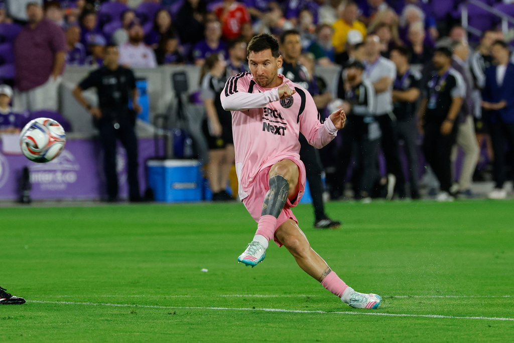 Inter Miami CF forward Lionel Messi takes practice kicks before an MLS soccer match against Orlando City SC, Sunday, March 1, 2026, in Orlando, Fla. (AP Photo/Kevin Kolczynski)