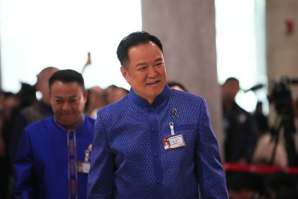 Thailand's Prime Minister Anutin Charnvirakul arrives at the parliament in Bangkok, Thailand, Thursday, March 19, 2026. (AP Photo/Sakchai Lalit)