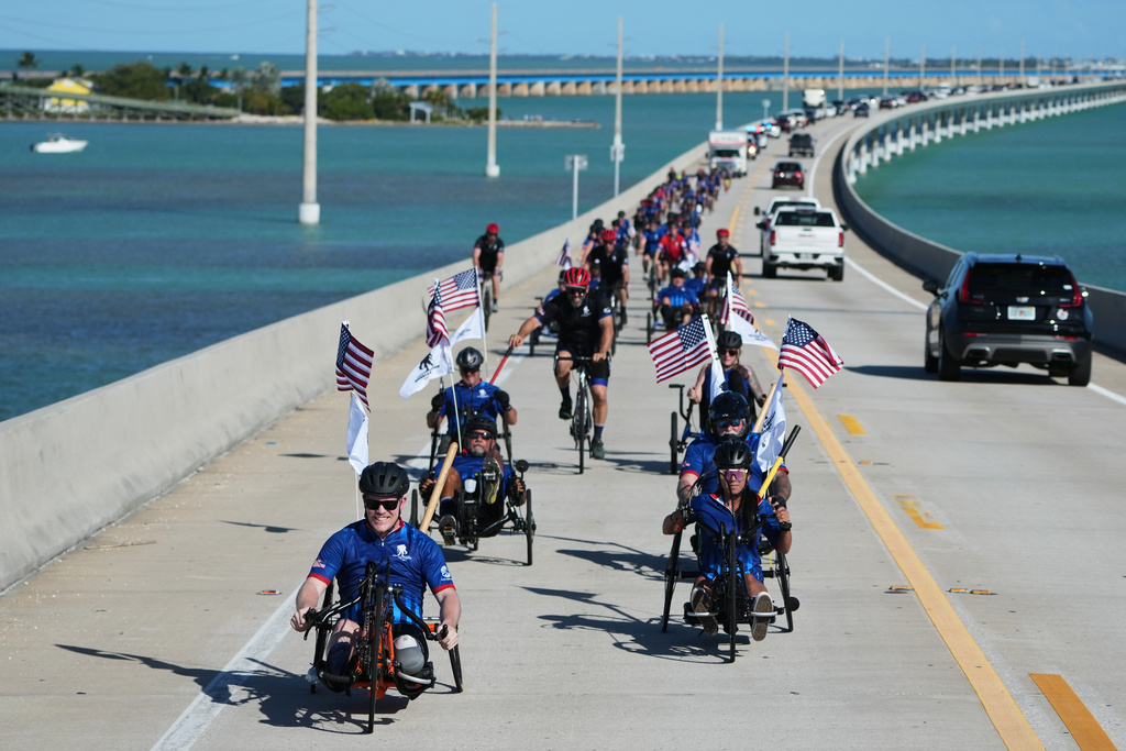 Wounded veterans ride over the Seven Mile Bridge in the annual Florida Keys Soldier Ride organized by the Wounded Warrior Project, Friday, Jan. 9, 2026, in Marathon, Fla. (AP Photo/Lynne Sladky)