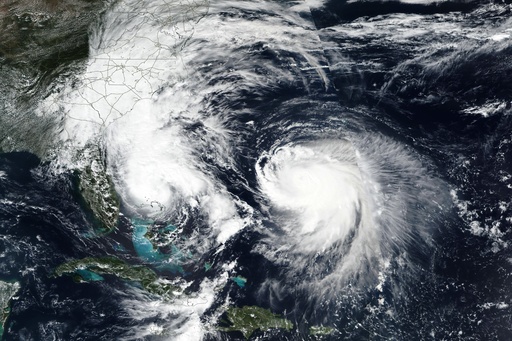 This Monday, Sept. 29, 2025, satellite image released by NASA shows Tropical Storm Imelda, left, and Hurricane Humberto in the Atlantic Ocean. (NASA Worldview, Earth Observing System Data and Information System (EOSDIS) via AP) This Monday, Sept. 29, 2025, satellite image released by NASA shows Tropical Storm Imelda, left, and Hurricane Humberto in the Atlantic Ocean. (NASA Worldview, Earth Observing System Data and Information System (EOSDIS) via AP)
