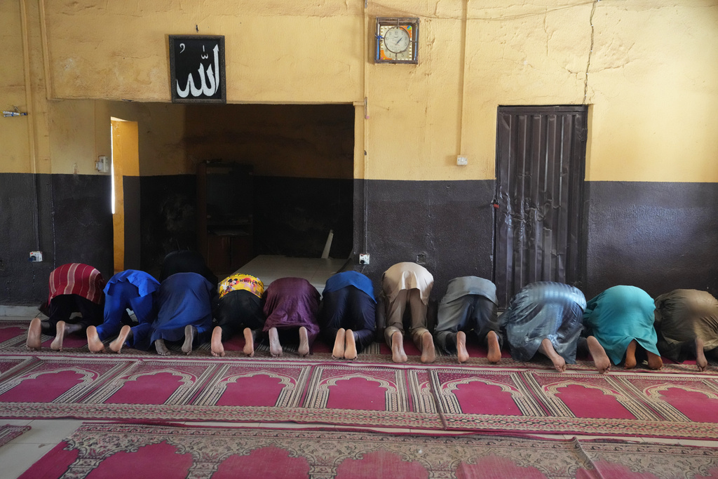Haruna Adamu, an imam who said he’s lost two brothers to violence, prays with others at a mosque in Kaduna, northwestern Nigeria, Nov. 5, 2025. (AP Photo/Sunday Alamba)